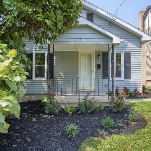 Home exterior with new porch and landscaping